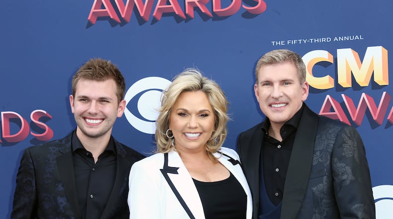 Chase Chrisley (from left), Julie Chrisley and Todd Chrisley attend the 53rd Academy of Country Music Awards at MGM Grand Garden Arena on Sunday, April 15, 2018, in Las Vegas. (Tommaso Boddi/Getty Images/TNS)