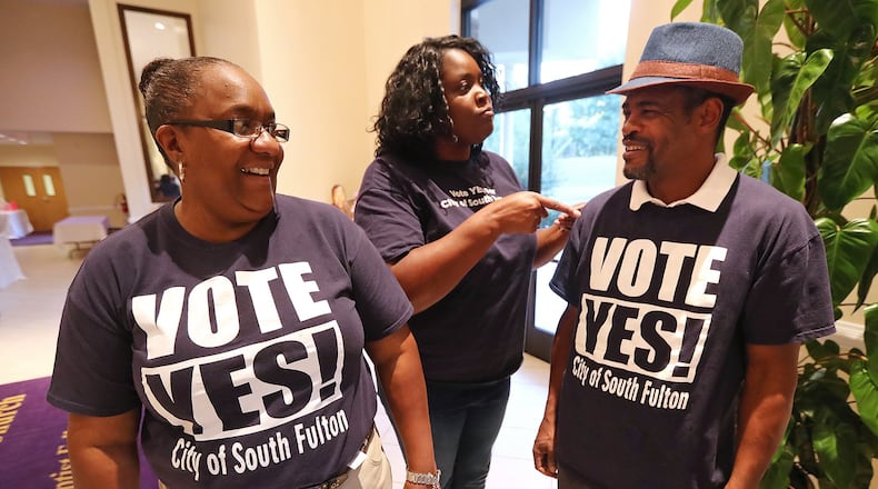 Damita Chatman (from left), Mandisha Thomas, and Kwame Wise sport shirts supporting cityhood as they arrive for a forum on what’s at stake if residents vote to form the City of South Fulton at Enon Baptist Church on Tuesday, Oct. 18, 2016, in College Park. All three are running for city council. Curtis Compton /ccompton@ajc.com AJC File Photo
