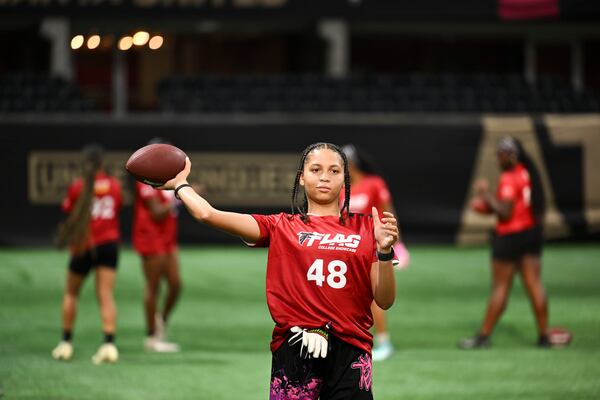 Alexa Mays warms up prior to the start of the 5th annual Girls Flag Football Showcase hosted  by the Atlanta Falcons Monday, August 25, 2025 at the Mercedez-Benz Stadium. (Daniel Varnado/For the Atlanta Journal-Constitution)