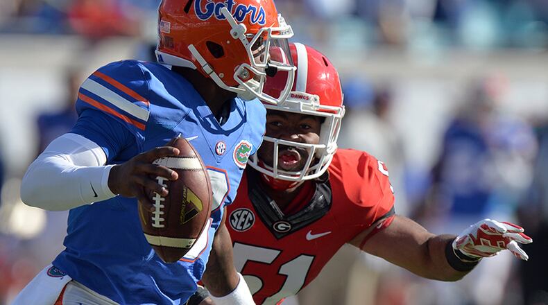 Georgia linebacker Ramik Wilson puts pressure on Florida quaterback Treon Harris.