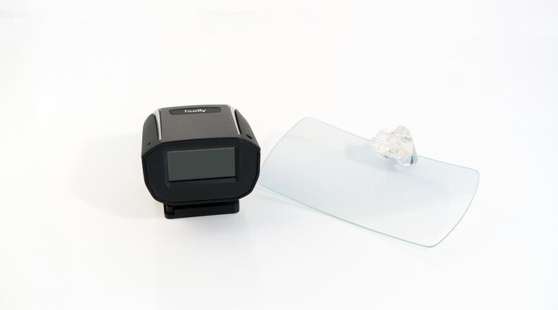The Hudly is a heads-up display used while driving that projects your phone s screen in your direct line of sight. (Handout/TNS)
