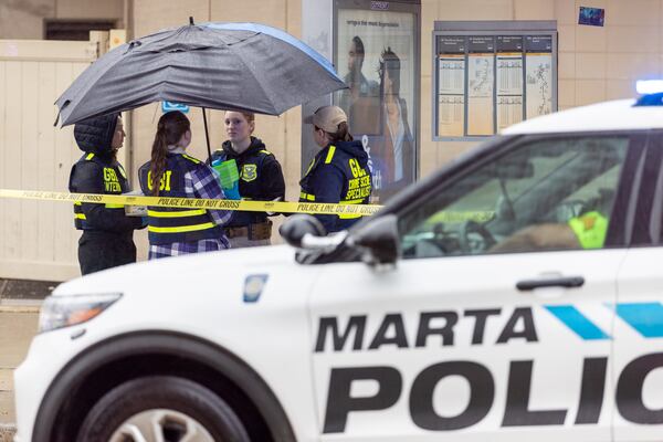 Police investigate following an officer-involved shooting outside the Five Points MARTA station in Atlanta.