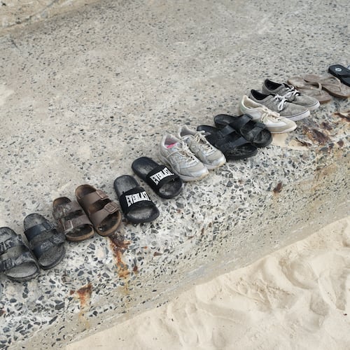 Shoes sit lined up following a shooting the day prior at Sydney's Bondi Beach, Monday, Dec. 15, 2025. (AP Photo/Mark Baker)