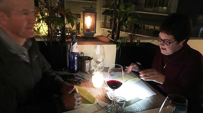 Georgia expatriates David and Erin Purvis fill out their Georgia election ballots at a restaurant in Athens, Greece. “We think it is our privilege and our responsibility as American citizens to vote even when living abroad,” Erin wrote later in an email. CONTRIBUTED