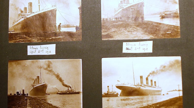 FILE - Photographs of the Titanic are displayed in a family album at the Transport museum in Belfast, Northern Ireland, Tuesday, Oct. 14, 2014. (AP Photo/Peter Morrison, File)