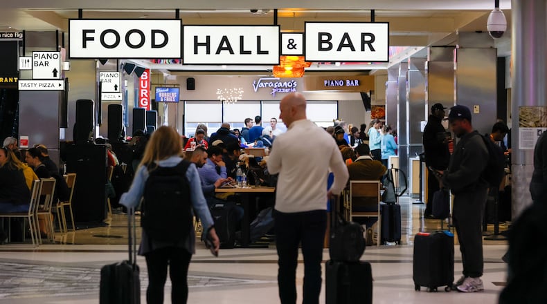 Passengers navigate through food concessions at Concourse A at Hartsfield-Jackson Atlanta International Airport on Monday, March 11, 2024.
Miguel Martinez /miguel.martinezjimenez@ajc.com