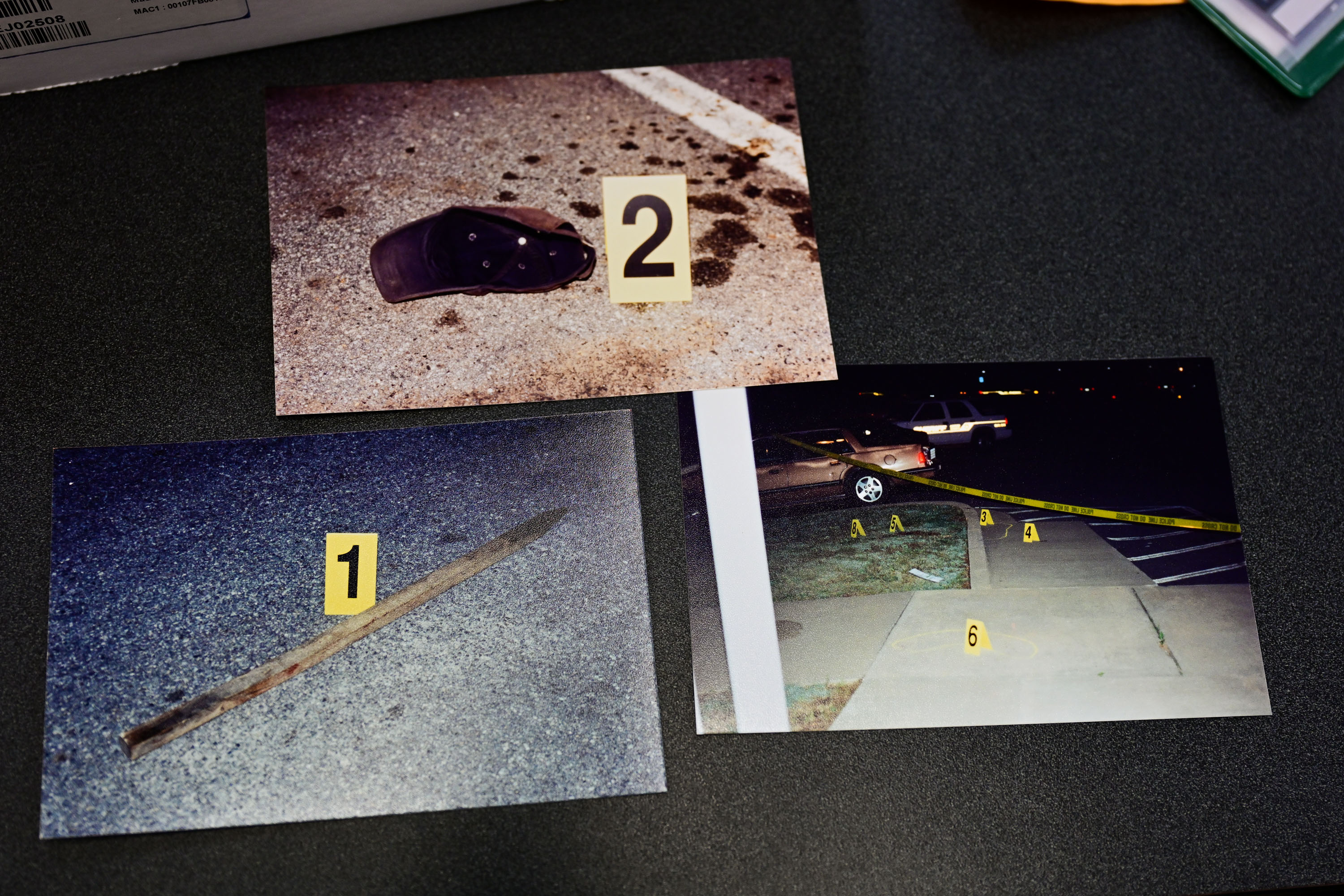 Photographic evidence of a wooden stake, ball cap and the area of the crime scene where Herman Wilder was killed are shown. (Daniel Varnado for the AJC)