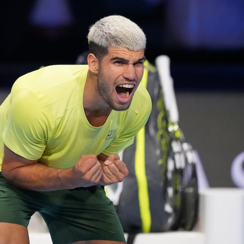 Spain's Carlos Alcaraz celebrates after winning against Italy's Lorenzo Musetti during the tennis match of the ATP World Tour Finals, in Turin, Italy, Thursday, Nov. 13, 2025. (AP Photo/Antonio Calanni)
