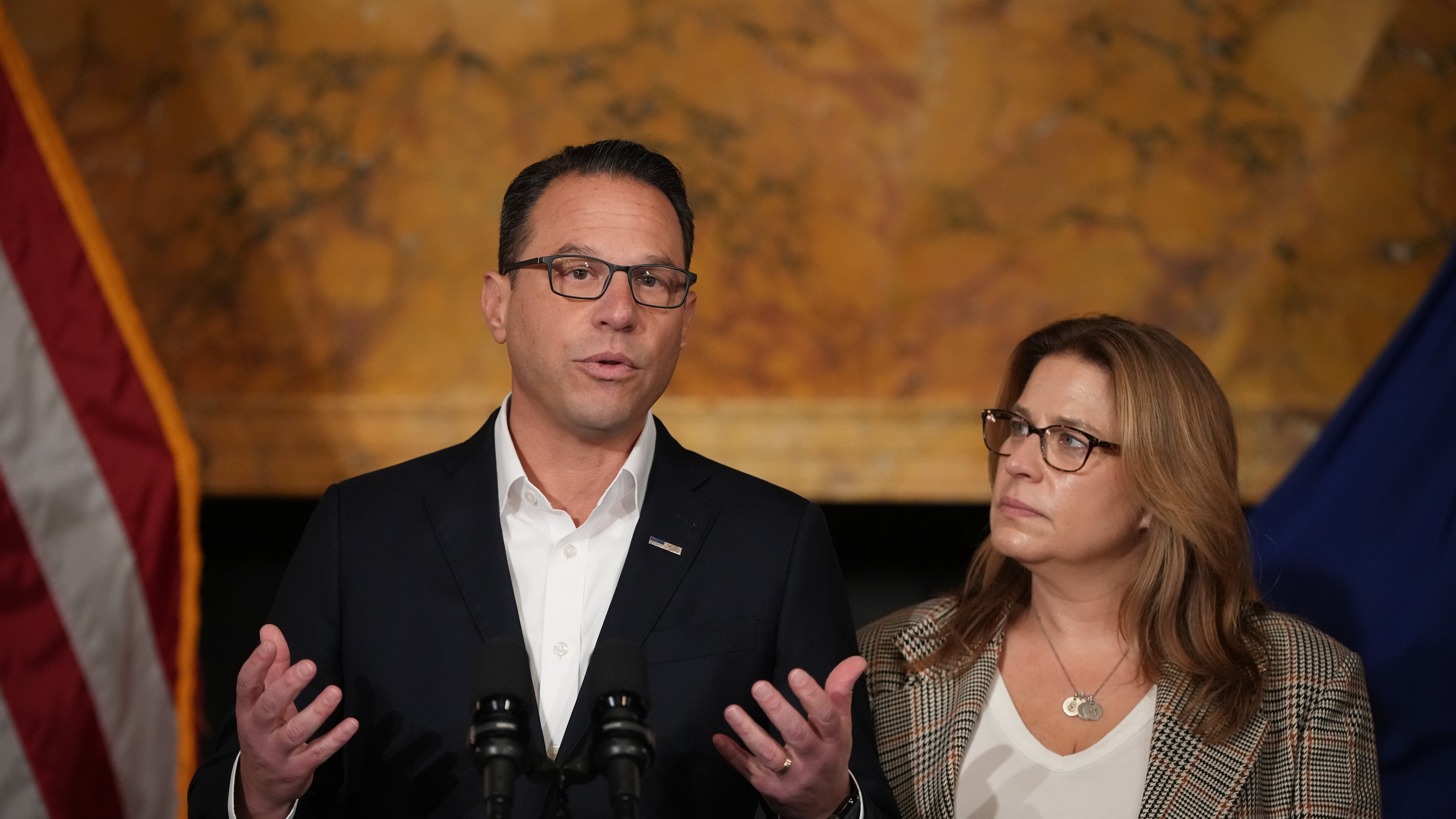 Pennsylvania Gov. Josh Shapiro, accompanied by his wife Lori Shapiro, speaks during a news conference after Cody Balmer plead guilty to attempted murder and other charges, on Tuesday, Oct. 14, 2025 in Harrisburg, Pa. (AP Photo/Matt Slocum)