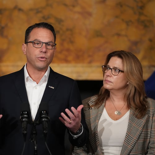 Pennsylvania Gov. Josh Shapiro, accompanied by his wife Lori Shapiro, speaks during a news conference after Cody Balmer plead guilty to attempted murder and other charges, on Tuesday, Oct. 14, 2025 in Harrisburg, Pa. (AP Photo/Matt Slocum)
