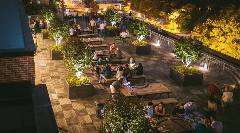 The rooftop beer garden at Nine Mile Station offers views of the Downtown, Midtown and Buckhead skylines. PHOTO CREDIT: Evan West