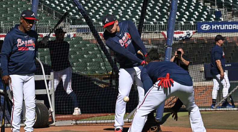 Atlanta Braves third baseman Austin Riley (27) works out with Atlanta Braves second baseman Ozzie Albies (1) prior to Game 2 of the 2023 National League Division Series at Truist Park, Monday, October 9, 2023, in Atlanta. (Hyosub Shin / Hyosub.Shin@ajc.com)