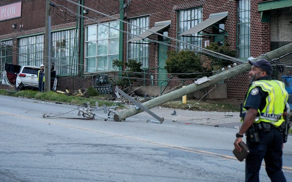 A car crash toppled a power pole and damaged gas lines in northwest Atlanta on Monday, Sept. 15, 2025. (Ben Hendren for the AJC)