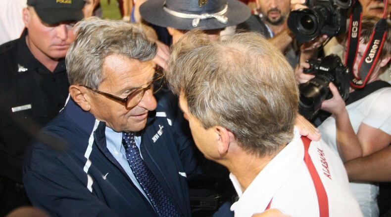 Nittany Lions head coach Joe Paterno (left) and Alabama Crimson Tide head coach Nick Saban greet each other after the game.