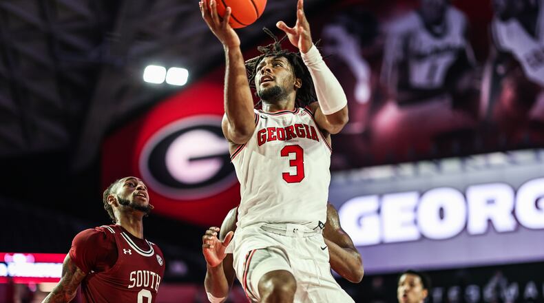 Georgia's Kario Oquendo goes up for shot against South Carolina at Stegeman Coliseum in Athens, Ga., on Saturday, Feb. 12, 2022. (Photo by Mackenzie Miles / UGA Athletics)