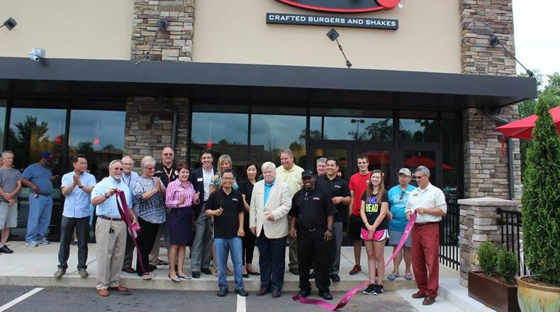 Burger 21 held a ribbon-cutting ceremony Monday at its new location on Scenic Highway in Snellville.