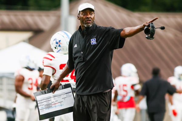 Quincy Carter was on the sideline for his first game as a head coach, leading Heritage High to a victory over Cedar Shoals High on Friday, Aug. 21, 2026. (Abbey Cutrer/AJC)