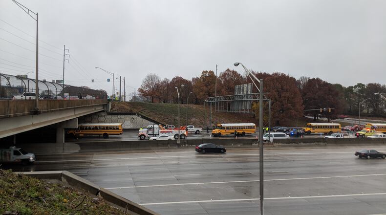 Dec. 8, 2017, Atlanta -- School buses from Rockdale County were at the head of a column of stopped automobiles along eastbound Interstate 20 near the Moreland Avenue exit late Friday morning.