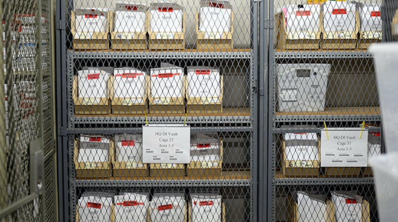Rape kits -- typically a DNA swab in an envelope, with other evidence -- in the vault at the Georgia Bureau of Investigation last week. KENT D. JOHNSON/KDJOHNSON@AJC.COM