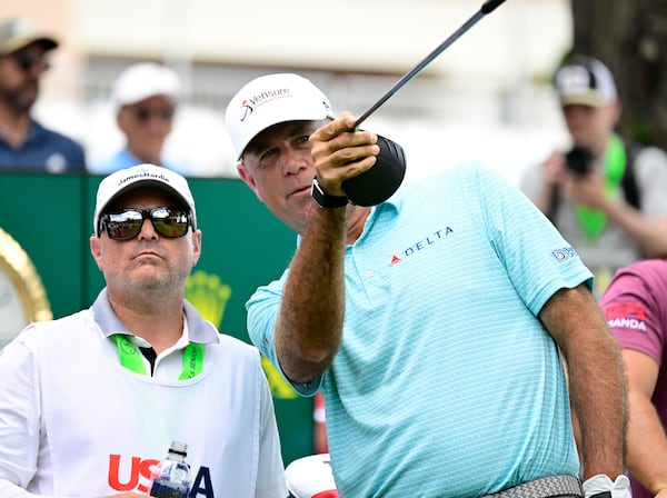 Stewart Cink, right, talks to his caddie, Chris Jones, before hitting from the first tee during the third round of the U.S. Senior Open Championship golf tournament at The Broadmoor, Saturday, June 28, 2025, in Colorado Springs, Colo. (Andy Cross/The Denver Post via AP)