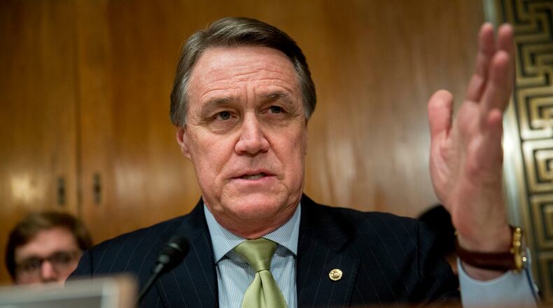 Senator David Perdue, a Republican from Georgia, questions Shaun Donovan, director of the Office of Management and Budget (OMB), not pictured, during a Senate Budget Committee hearing in Washington, D.C., U.S., on Tuesday, Feb. 3, 2015. President Barack Obama's budget plan seeks to spend, tax, regulate and borrow more while sticking U.S. taxpayers with the bill, said the Republican who leads the Senate Budget Committee. Photographer: Andrew Harrer/Bloomberg *** Local Caption *** David Perdue U.S. Sen. David Perdue, R-Ga., at a Senate hearing in February. (Bloomberg/Andrew Harrer)