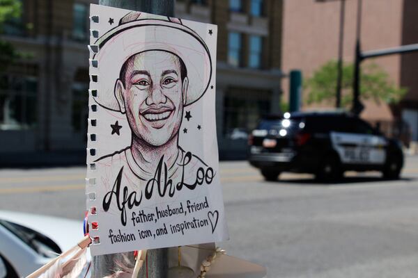 A makeshift memorial for Arthur Folasa Ah Loo, known to friends and family as Afa, is seen Tuesday, June 17, 2025, in downtown Salt Lake City, Utah, on the block where Ah Loo was fatally shot during a "No Kings" protest on Saturday, June 14. (AP Photo/Hannah Schoenbaum)