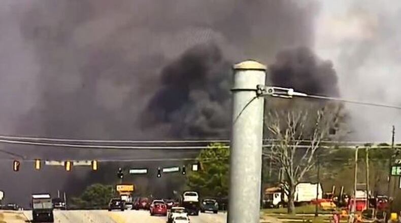 The blaze sent large plumes of black smoke over South Cobb Drive near Pat Mell and Austell roads.