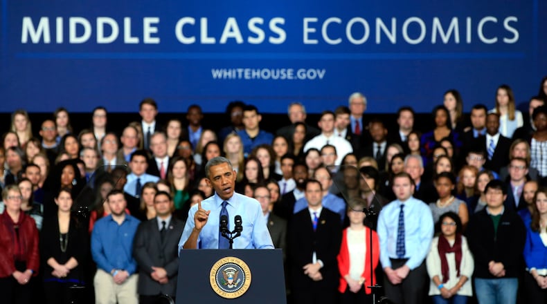 LAWRENCE, KS - JANUARY 22: U.S. President Barack Obama speaks at the University Of Kansas at the Anschutz Pavillion on January 22, 2015 in Lawrence, Kansas. Obama is traveling to push his State of the Union agenda. (Photo by Jamie Squire/Getty Images) The sign-maker misspelled "middling." (Jamie Squire / Getty Images)