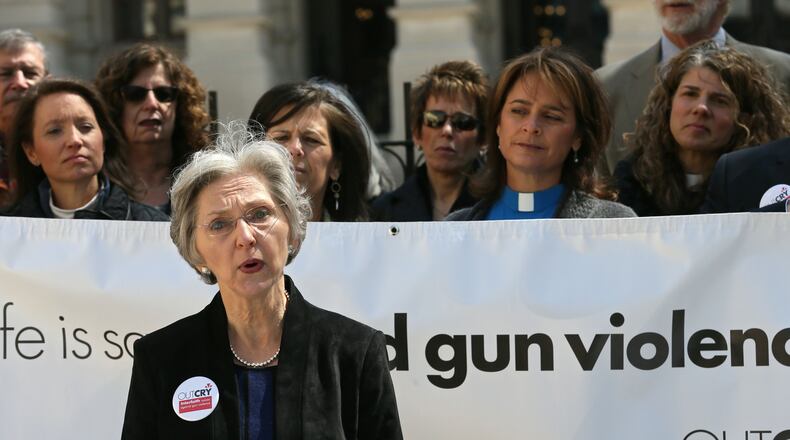 The Rev. Jane Fahey, interim associate pastor of Trinity Presbyterian Church, speaks against HB 859, the campus-carry bill. Outcry, a coalition of faith leaders against gun violence, held a press conference urging Gov. Nathan Deal to veto the legislation. Bob Andres, bandres@ajc.com