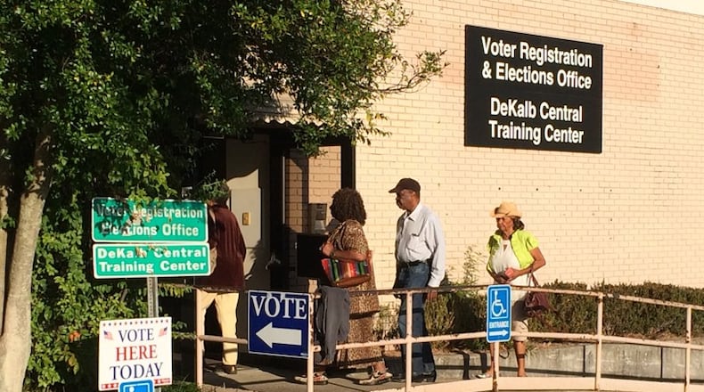 Voters walk in The DeKalb County Voter Registration and Elections Office off Memorial Drive on Monday morning as early voting begins. JOSHUA SHARPE/JOSHUA.SHARPE@AJC.COM