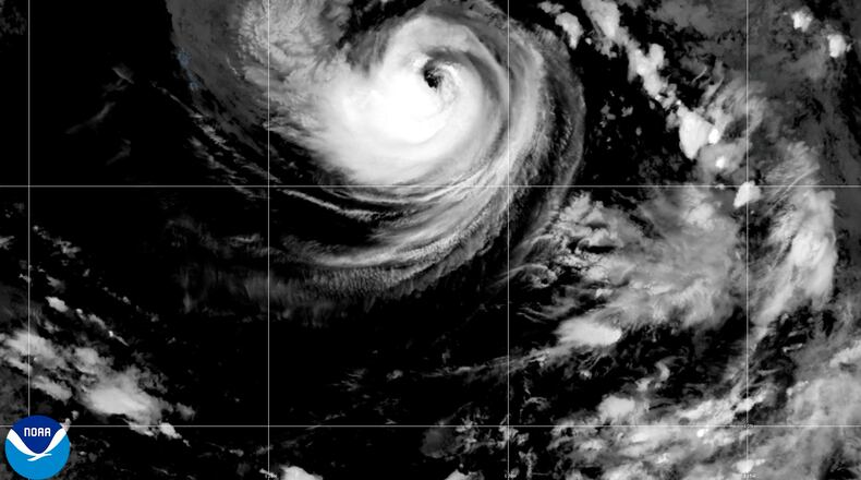 This satellite image released by NOAA shows Hurricane Karina strengthening off the southern tip of Baja California on Sunday, Aug. 30, 2026. (NOAA via AP)