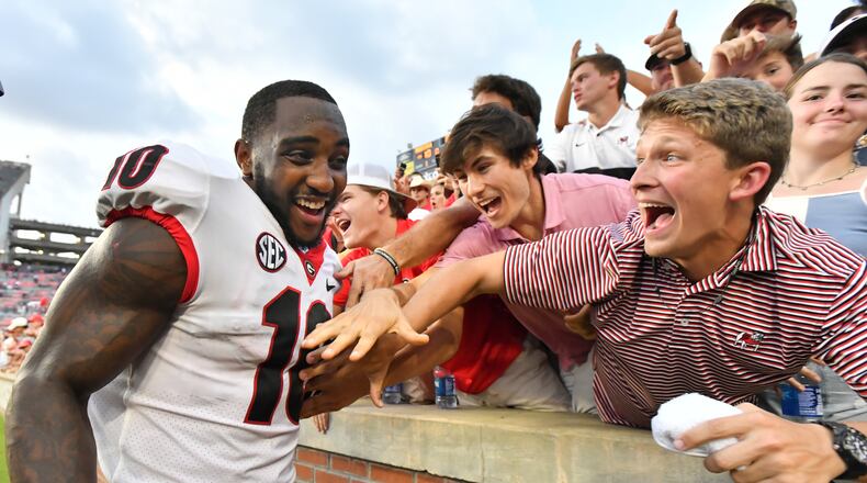 October 9, 2021 Auburn, Georgia wide receiver Kearis Jackson (10) celebrates with fans after Georgia defeat Auburn in an NCAA college football game at Jordan–Hare Stadium in Auburn, Alabama on Saturday, October 9, 2021. Georgia won 34-10 over Auburn. (Hyosub Shin / Hyosub.Shin@ajc.com)