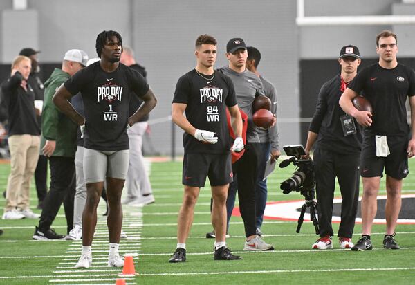 Georgia quarterback Gunner Stockton (far right) threw to former UGA wide receiver Marcus Rosemy-Jacksaint (left) and Ladd McConkey during Georgia Pro Day at Payne Indoor Athletic Facility, Wednesday, Mar. 13, 2024, in Athens. (Hyosub Shin/AJC)