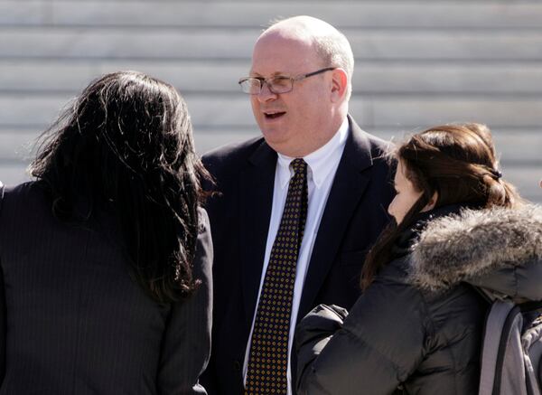 FILE - Attorney Marc Elias stands on the plaza of the Supreme Court in Washington, March 21, 2016. (AP Photo/J. Scott Applewhite, File)