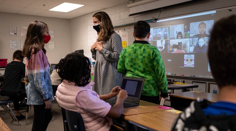 Jordan Greene works with her “Roomies” and her “Zoomies” during fifth grade language arts at Freeman’s Mill Elementary School in Lawrenceville on Monday morning, Nov. 2, 2020. Due to the hardship of learning during a pandemic, the federal government waived "accountability" for schools last year. That is why the Georgia Department of Education quietly released pieces of the annual College and Career Ready Performance Index without compiling them into school scores. (Ben Gray for The Atlanta Journal-Constitution)