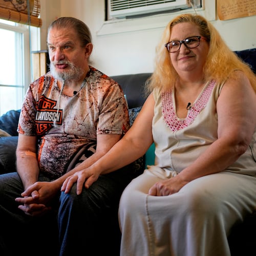 Brian and Brenda Marquis talk about a robot that helps them stay on task with everything from daily exercise to medication reminders at their apartment Tuesday, April 21, 2026, in Durham, N.H. (AP Photo/Robert F. Bukaty)