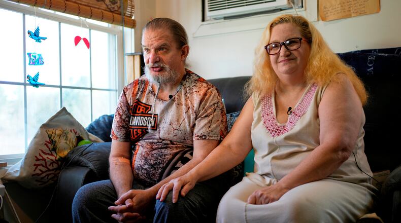 Brian and Brenda Marquis talk about a robot that helps them stay on task with everything from daily exercise to medication reminders at their apartment Tuesday, April 21, 2026, in Durham, N.H. (AP Photo/Robert F. Bukaty)