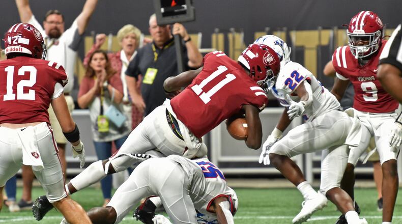 August 21, 2021 Atlanta - Lowndes' QB Jacurri Brown (11) dives into the endzone for a touchdown during the 2021 Corky Kell Classic on Saturday, August 21, 2021. (Hyosub Shin / Hyosub.Shin@ajc.com)