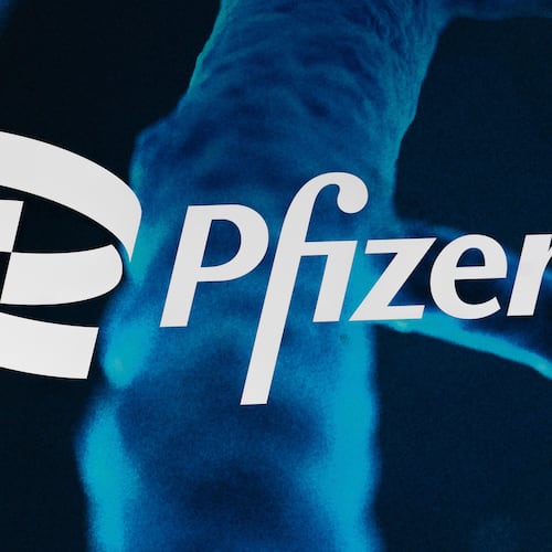 FILE - The Pfizer logo is displayed at the company's headquarters, Friday, Feb. 5, 2021, in New York. (AP Photo/Mark Lennihan, File)