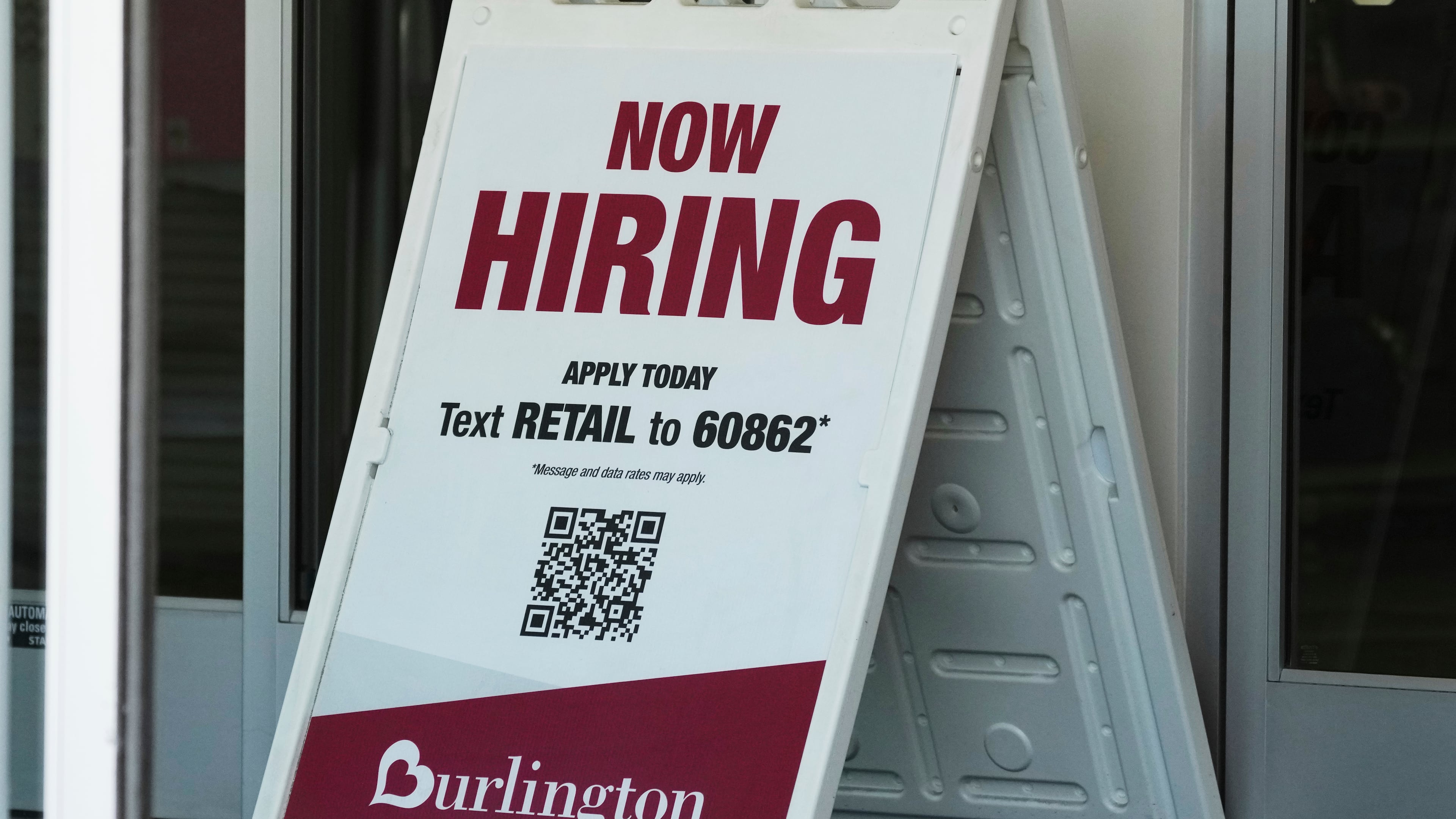 "Now Hiring" sign is displayed at a retail store in Schaumburg, Ill., Thursday, Sept. 18, 2025. (AP Photo/Nam Y. Huh)