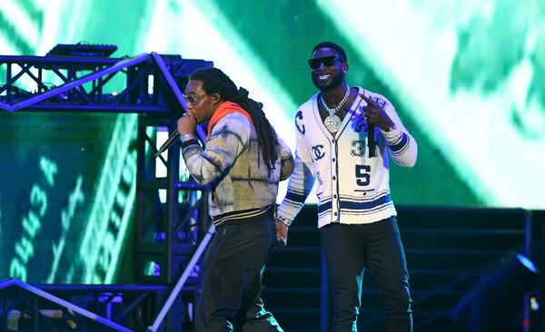 Takeoff of Migos (front) and Gucci Mane perform onstage during the Bud Light Super Bowl Music Fest / EA SPORTS BOWL. Takeoff was accused of rape.