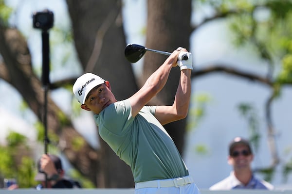 Collin Morikawa hits on the first hole during the third round of the Truist Championship golf tournament at the Philadelphia Cricket Club, Saturday, May 10, 2025, in Flourtown. (AP Photo/Matt Rourke)