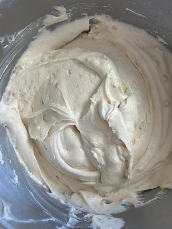 Demi Lovato's Favorite Birthday Cake recipe calls for full-fat Greek yogurt thinned with water, which helps the cake earn its fluffy, moist texture. (Olivia Wakim/AJC)