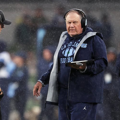 North Carolina head coach Bill Belichick, right, speaks with an official during an NCAA college football game against TCU in Dublin, Ireland, Saturday, Aug. 29, 2026. (AP Photo/Peter Morrison)