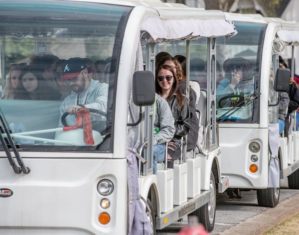 Trams in front of the Covington Visitors Center are packed with "Vampire Diaries" fans eager to tour the show's filming sites. The tours are operated by Vampire Stalkers Mystic Falls Tours. (Photo courtesy of Discover Covington)