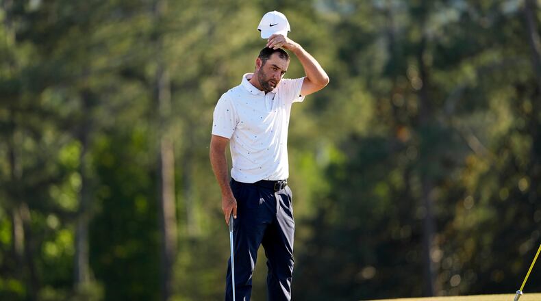 Scottie Scheffler finishes his final round of the Masters golf tournament at the Augusta National Golf Club, Sunday, April 12, 2026, in Augusta, Ga. (AP Photo/David J. Phillip)