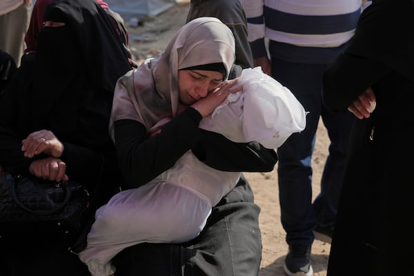 Heba Shakura mourn her son Islam Abu Mahdi who was killed in an Israeli army airstrike, during his funeral at the Indonesian hospital in Beit Lahia, northern Gaza Strip, Monday, April 28, 2025. (AP Photo/Jehad Alshrafi)