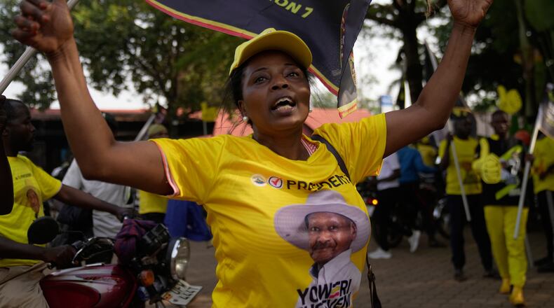 A woman celebrates Ugandan President Yoweri Museveni's victory in the presidential election in Kampala, Uganda, Saturday, Jan. 17, 2026. (AP Photo/Brian Inganga)