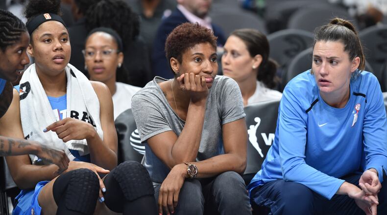 Atlanta Dream forward Angel McCoughtry (center) watches with teammates during the first half of WNBA basketball game at State Farm Arena in Atlanta on Wednesday, June 19, 2019. Atlanta Dream won 88-78 over the Indiana Fever. HYOSUB SHIN / HSHIN@AJC.COM