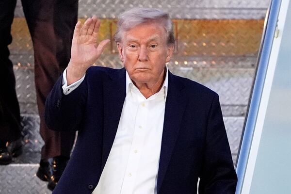 President Donald Trump arrives at Palm Beach International Airport, Friday, April 11, 2025, in West Palm Beach, Fla. (AP Photo/Manuel Balce Ceneta)
